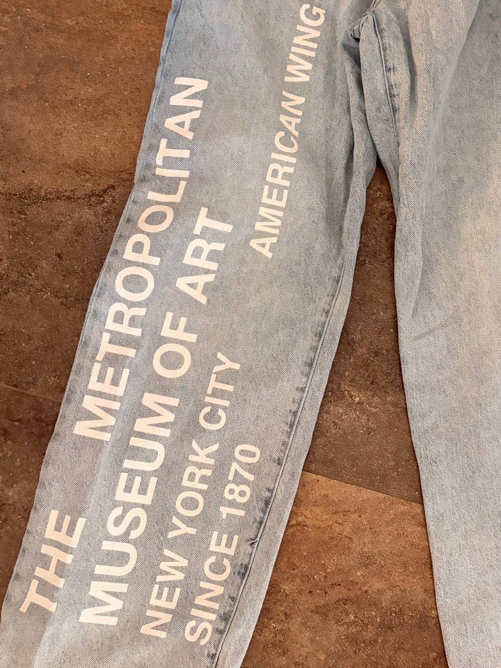 THE MET- Light Blue Relaxed Jeans with White Graphic Text